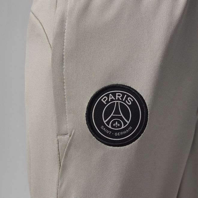 Afbeelding van Paris Saint-German Strike Nike Dri-FIT Knit Voetbaltrainingspak met Capuchon Kids Stone