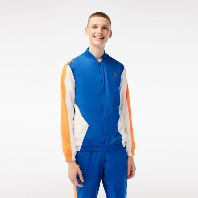 Afbeelding van Lacoste Trainingspak Blauw Oranje Wit