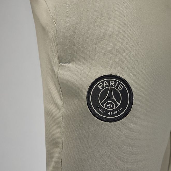 Afbeelding van Paris Saint-German Strike Nike Dri-FIT Knit Voetbaltrainingspak met Capuchon Stone