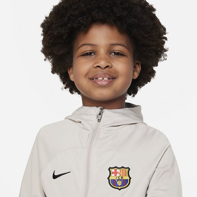 Afbeelding van FC Barcelona Strike Nike Dri-FIT Voetbaltrainingspak met Capuchon Kleuters String