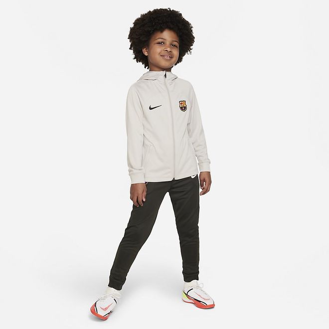 Afbeelding van FC Barcelona Strike Nike Dri-FIT Voetbaltrainingspak met Capuchon Kleuters String