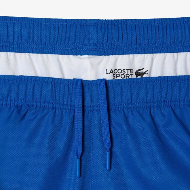 Afbeelding van Lacoste Trainingspak Blauw Oranje Wit