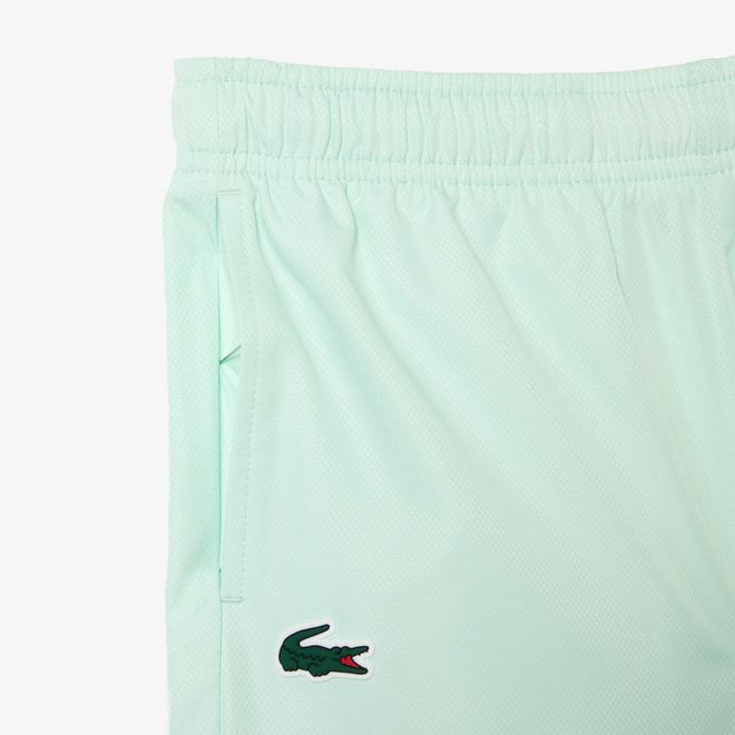 Afbeelding van Lacoste Trainingspak Stretchstof Colorblock Groen Wit Felgeel