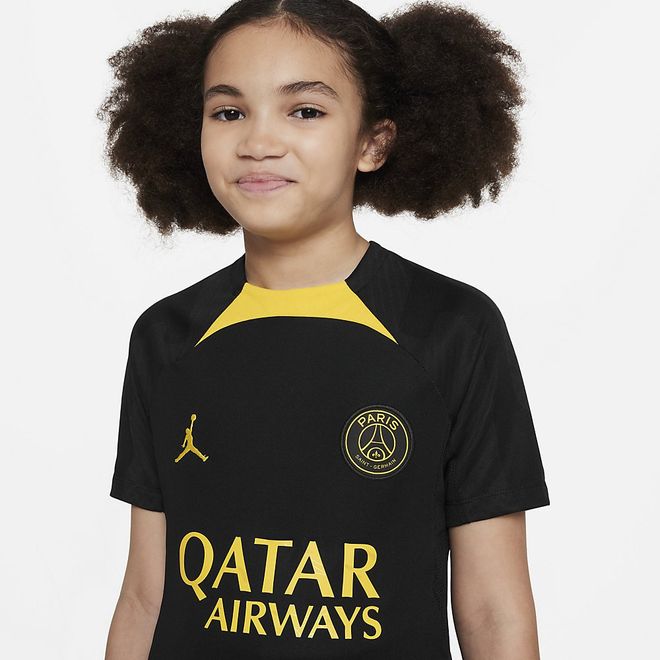 Afbeelding van Paris Saint-Germain Strike Jordan Dri-FIT Voetbaltrainingshirt Kids Black Tour Yellow