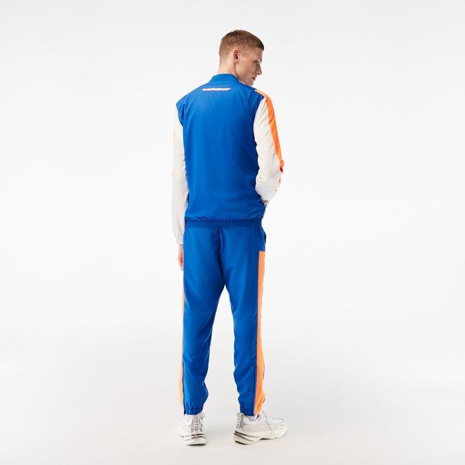 Afbeelding van Lacoste Trainingspak Blauw Oranje Wit