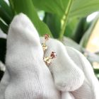 Image 7 of Gold stud earrings with red/rose stone