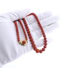 Image 9 of Antique blood coral bead necklace with gold decorative clasp.