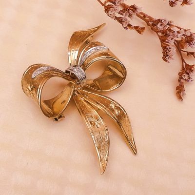 Image 2 of Gold brooch in the form of a bow with diamonds; 0.035 ct.