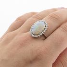 Image 9 of 18-karat white gold ring with opal and entourage of diamonds | 0.60 ct.