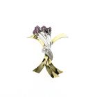 Image 1 of Two-tone gold brooch with ruby and diamonds; 0.06 ct.
