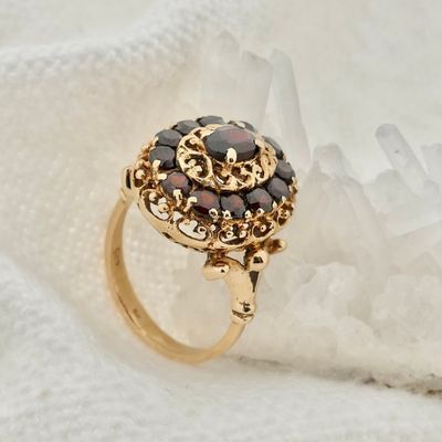Image 2 of Gold entourage ring with garnet