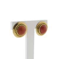 Gold ear clips with red coral.