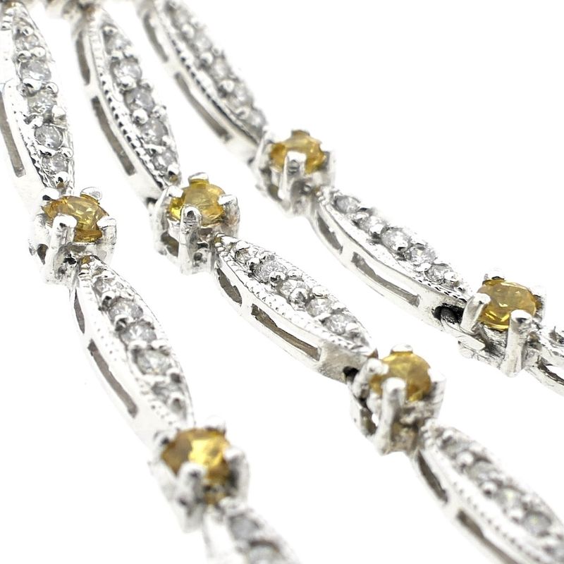 Image 6 of White gold stud earrings with yellow sapphire and diamond; 0.56 ct.