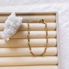 Image 2 of Gold closed Figaro link bracelet.