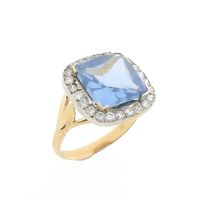 Two-tone cocktail ring with topaz and zirconia