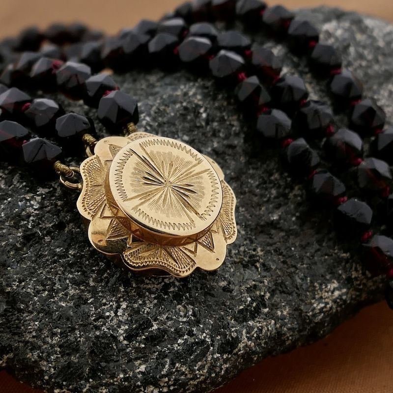 Image 2 of Antique garnet bead necklace with gold decorative clasp.