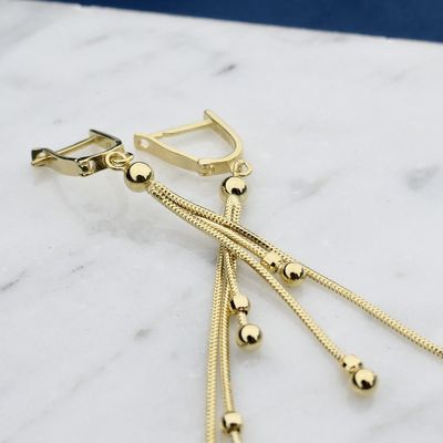 Afbeelding 2 van Lange gouden oorbellen met bolletjes