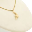 Image 8 of Gold pendant of a revolver.