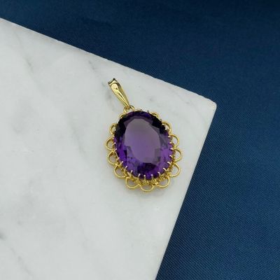 Image 2 of Gold pendant with purple glass