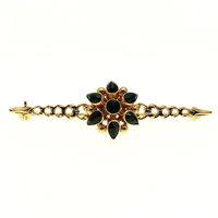 Gold antique brooch with garnet stones