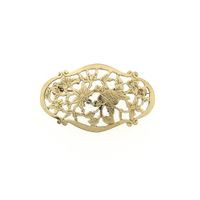 Vintage gold brooch with a floral design