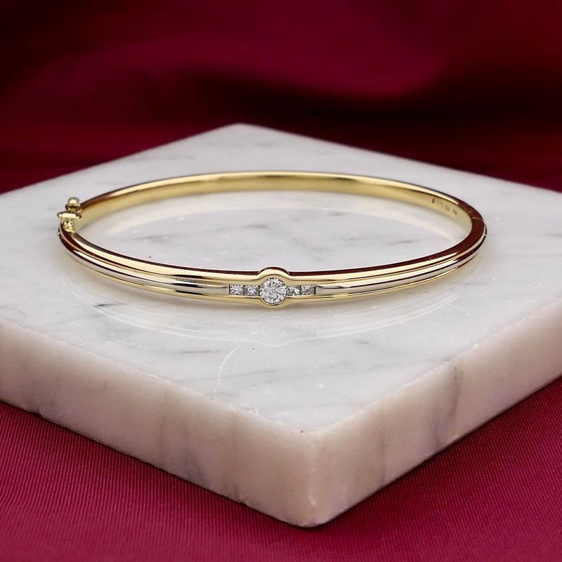 Afbeelding 2 van Bicolor gouden slavenarmband met diamanten; Maat M/L