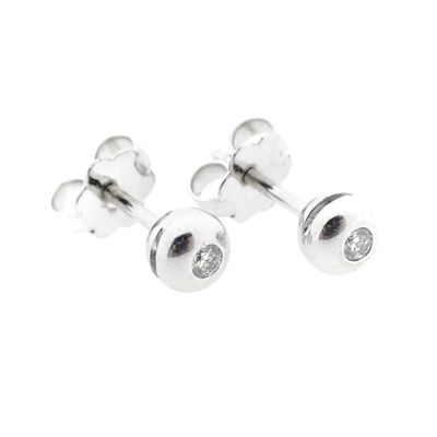 Image 1 of 18 carat white gold solitaire stud earrings with 0.07 ct. diamonds.