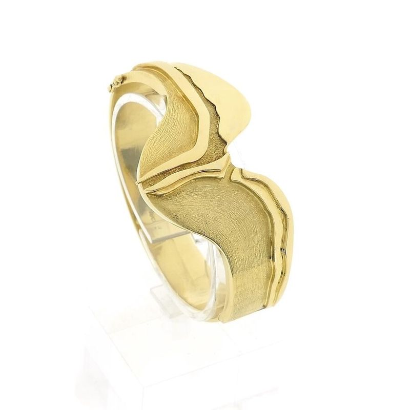 Image 1 of Robust gold slave bracelet.