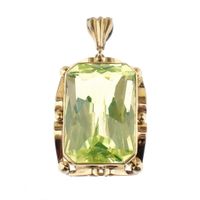 Gold pendant with synthetic gemstone