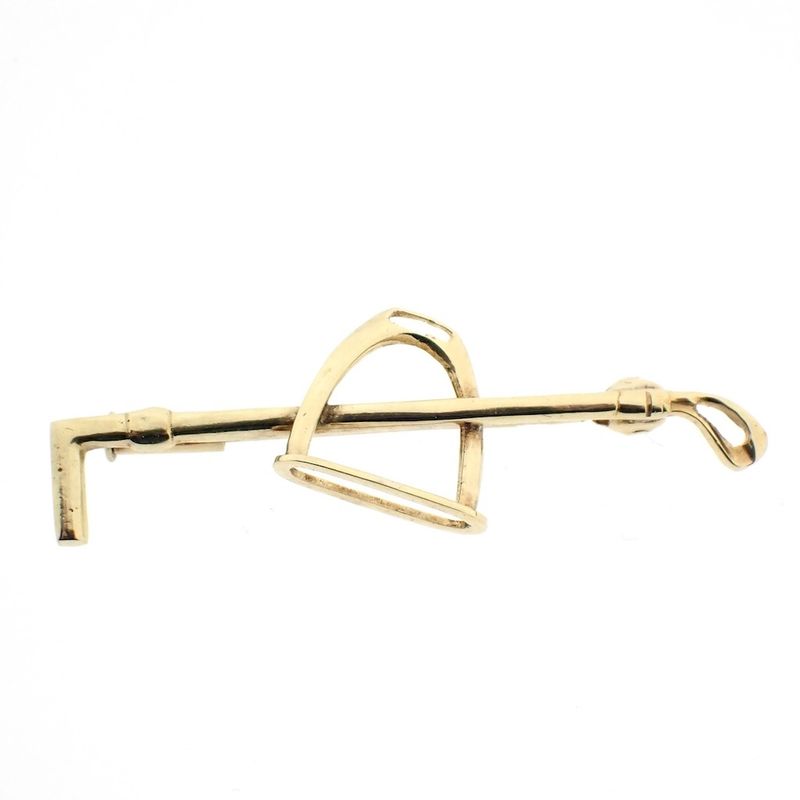 Image 1 of Golden polo sports brooch.