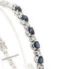 Image 2 of White gold cobra link bracelet with sapphire and diamond; 0.24 ct.