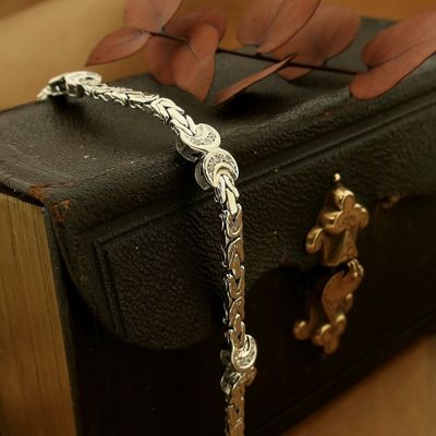 Image 2 of White gold flat king bracelet with fixed charms and 0.24 ct diamond.