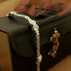 Image 2 of White gold flat king bracelet with fixed charms and 0.24 ct diamond.