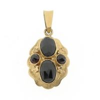 Vintage gold pendant with garnet