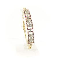 Gold link bracelet with ruby ​​and diamonds; 0.89 ct.