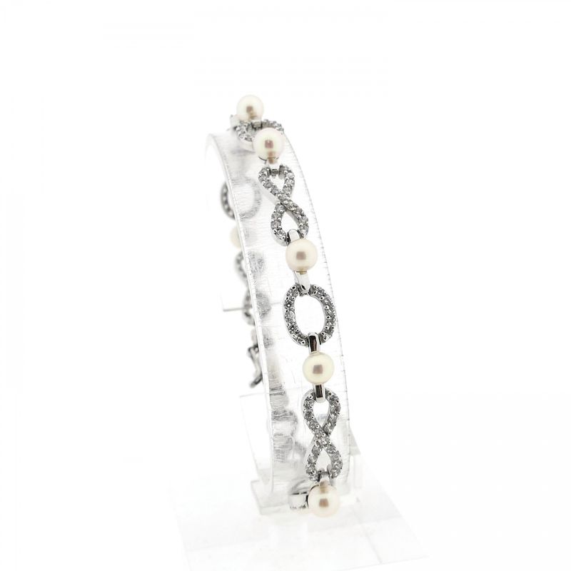 Afbeelding 1 van Witgouden infinityschakel armband met parel en zirconia | 19,5 cm
