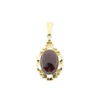 Vintage gold pendant with garnet