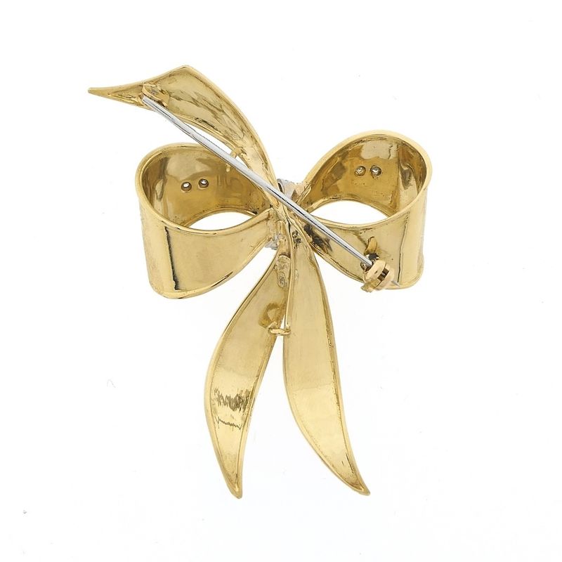Image 7 of Gold brooch in the form of a bow with diamonds; 0.035 ct.