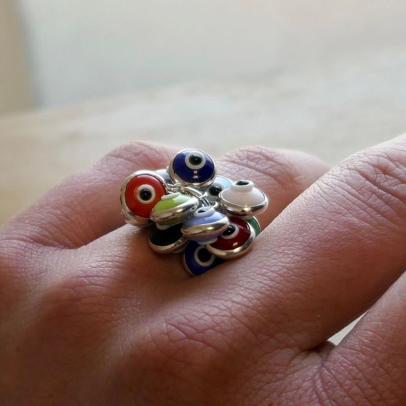 Image 6 of Silver ring with multiple colored Nazar eye charms