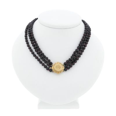 Antique garnet bead necklace with gold decorative clasp. Image 1 of Antique garnet bead necklace with gold decorative clasp.