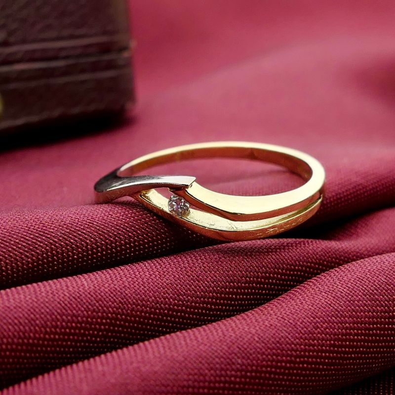 Image 2 of Two-tone gold ring with diamond; 0.03 ct.