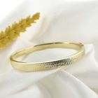 Image 2 of Gold slave bracelet with pattern; Size M