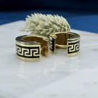 Image 2 of Gold hinged hoop earrings with a meandering pattern in black enamel; Ø 15.2 mm