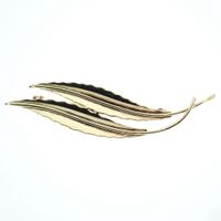 Gold brooch with two feathers