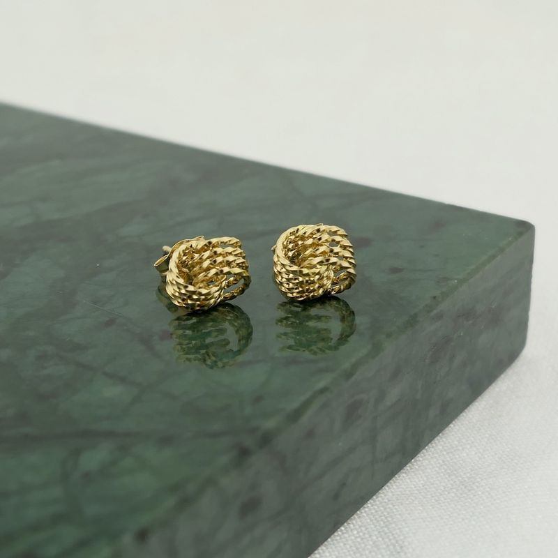 Image 2 of Gold twisted stud earrings as a button