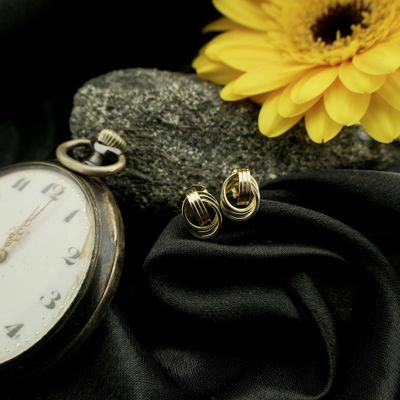 Image 2 of Gold stud earrings as a button