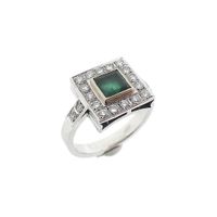 1950s white gold ring set with a 0.50 ct. diamond and emerald