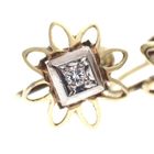 Image 5 of Two-tone gold vintage clip-on earrings with a floral design | 0.06 ct diamond.