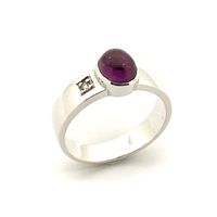 Silver solitaire ring with an oval cut amethyst stone