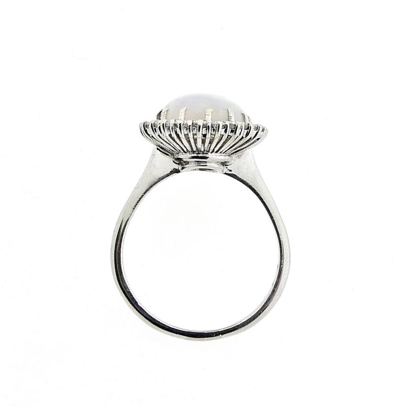 Image 11 of 18-karat white gold ring with opal and entourage of diamonds | 0.60 ct.